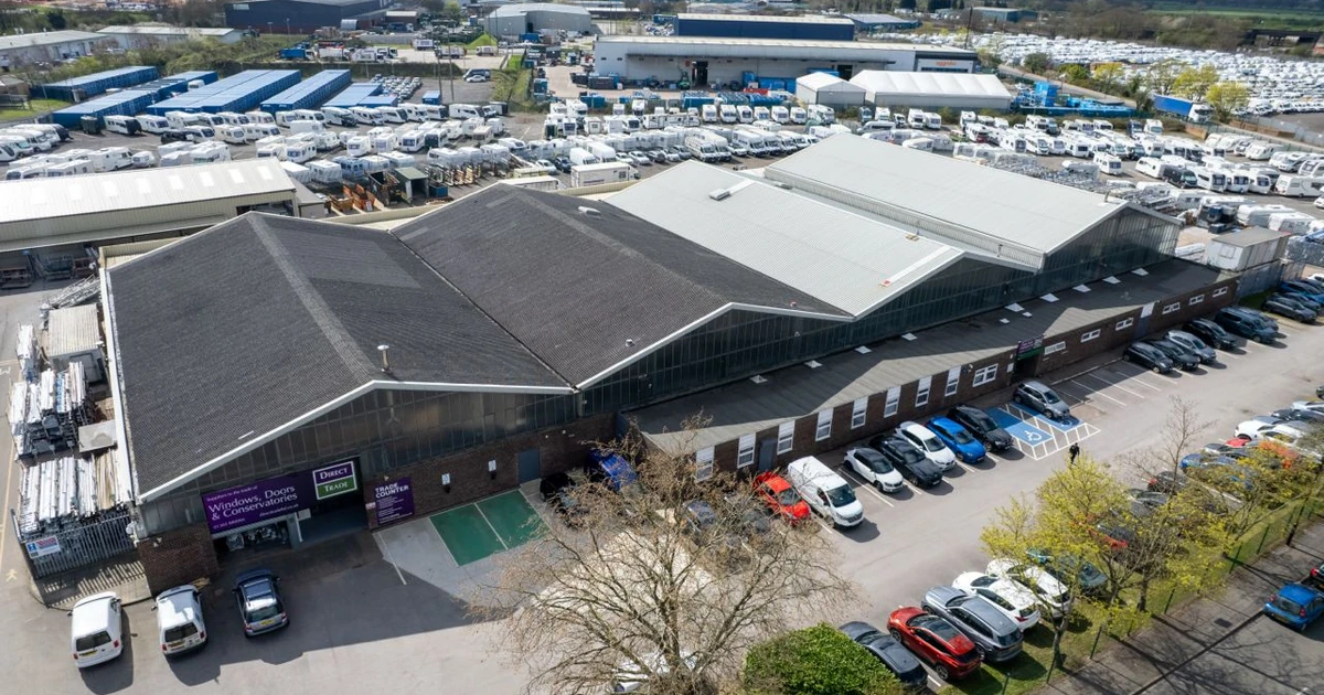 Aerial view of Direct Trade's head office and facility with parked cars and delivery vehicles in Doncaster