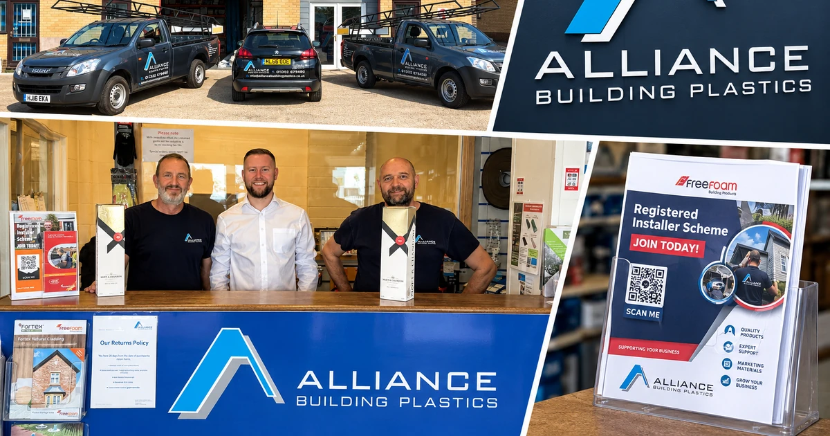 Three men behind an Alliance Building Plastics counter with branded signage, vehicles parked outside the warehouse, and promotional materials visible indoors
