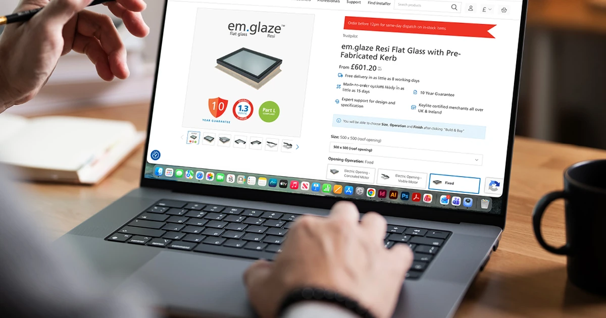 Person using the Keylite flat roof configurator tool on a laptop in a home setting